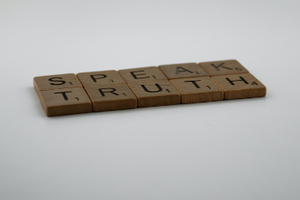 Speak truth spelled out in Scrabble tiles