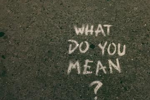 What do you mean? written in chalk on sidewalk
